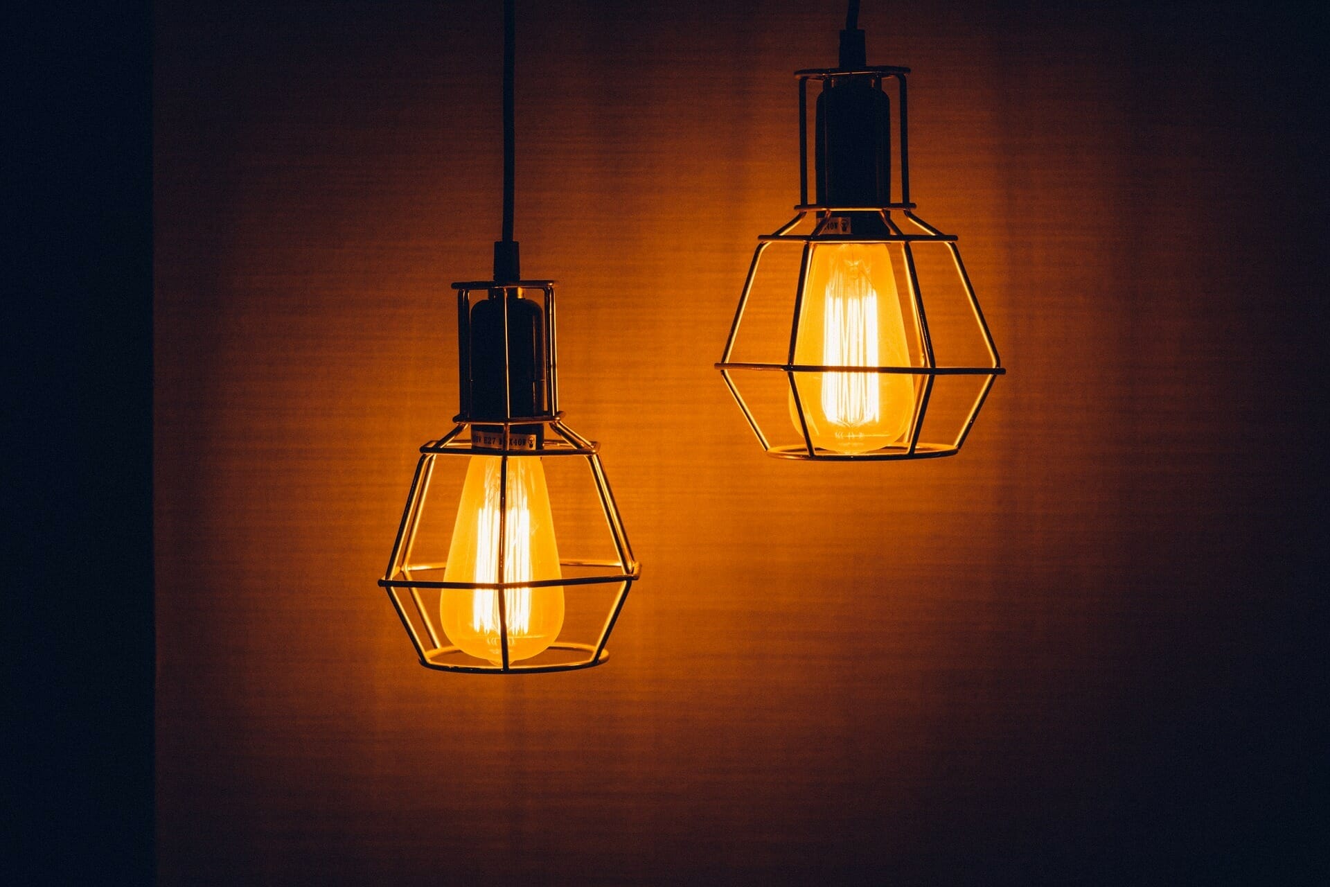 2 light bulbs in dark room